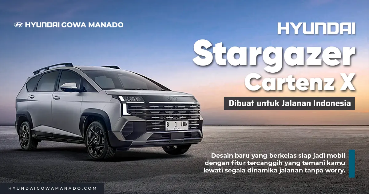 Mobil MPV tangguh Hyundai Stargazer Cartenz X abu-abu gelap di jalanan kota raya, materi resmi milik Hyundai Gowa Manado